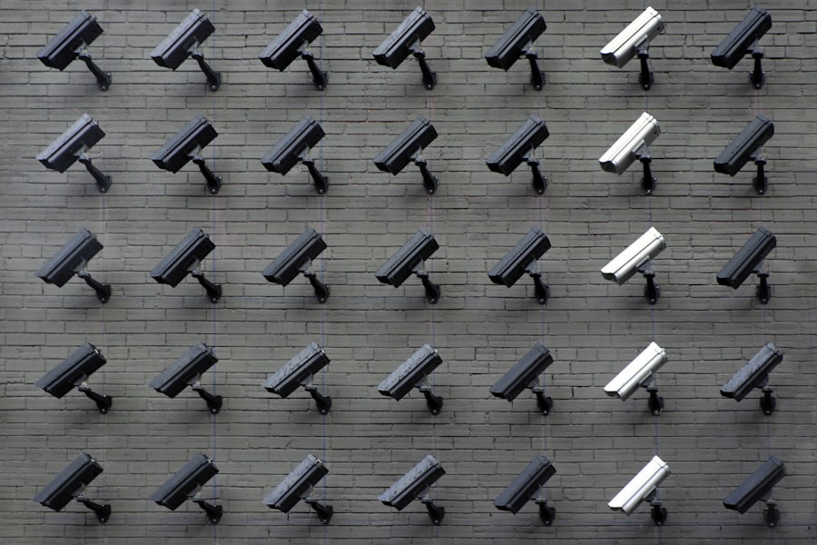 Grid of CCTV surveillance cameras on a wall